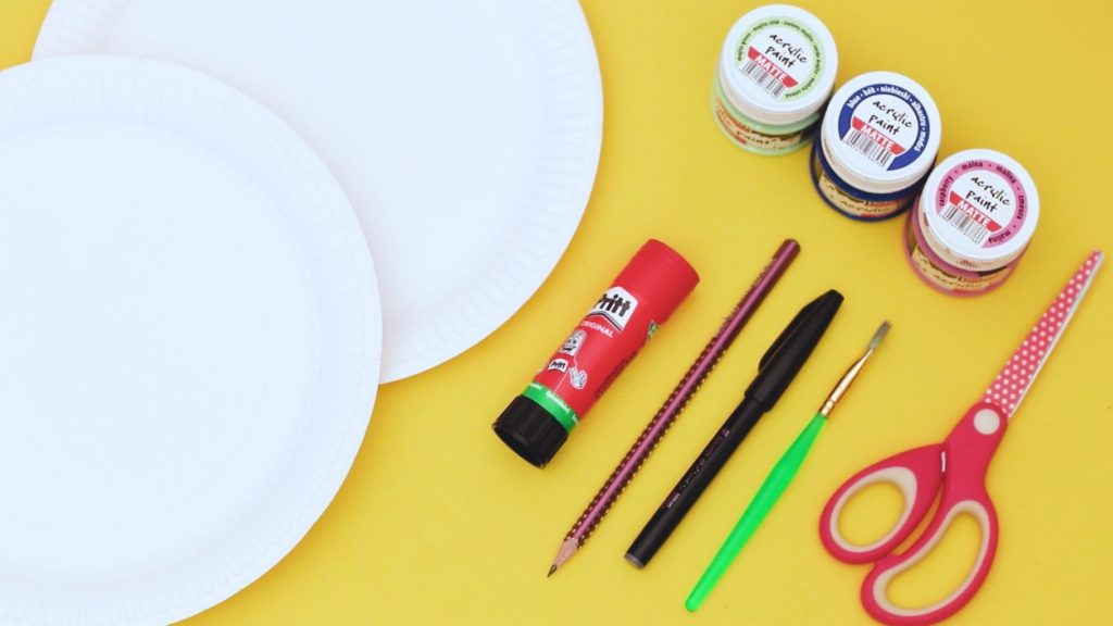 Image showing two paper plates, paint, paint brush, glue stick, scissors and pencil.