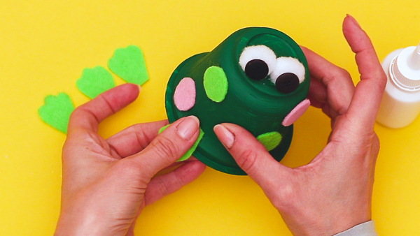 Learn how to make a recycled frog craft with the kids this Spring! Whether it's for a spring themed craft or learning about the life cycle of a frog.