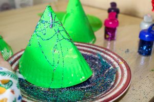 Cute, simple and perfect for toddlers and preschoolers! this simple 3d Paper Plate Christmas Tree craft is perfect for developing fine motor skills while getting into the festive spirit! An easy Christmas craft for preschool or group craft sessions.