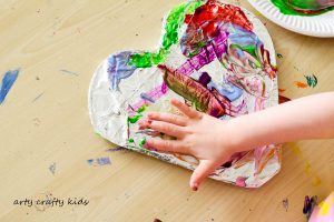 Arty Crafty Kids | Art | Messy Heart Painting | An amazing hands-on sensory art session for kids to explore texture and colour mixing. Super fun and easy art ideafor kids, with a set-up tine of less than 5 minutes!