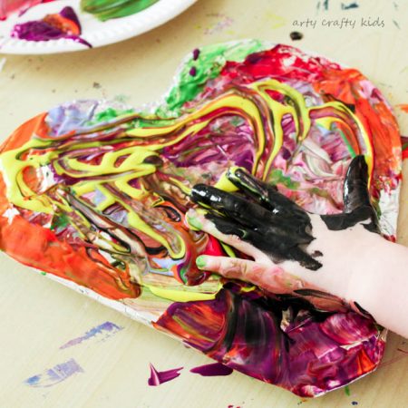 Arty Crafty Kids | Art | Messy Heart Painting | An amazing hands-on sensory art session for kids to explore texture and colour mixing. Super fun and easy art ideafor kids, with a set-up tine of less than 5 minutes!