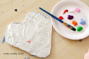 Arty Crafty Kids | Art | Messy Heart Painting | An amazing hands-on sensory art session for kids to explore texture and colour mixing. Super fun and easy art ideafor kids, with a set-up tine of less than 5 minutes!