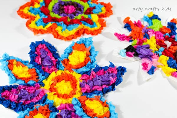 Arty Crafty Kids | Craft | Colourful Spring Paper Plate Flower Craft | A fun and simple Spring craft for kids. Toddlers and preschoolers will love the process of tearing, scrunching and sticking to make pretty paper plate flowers.