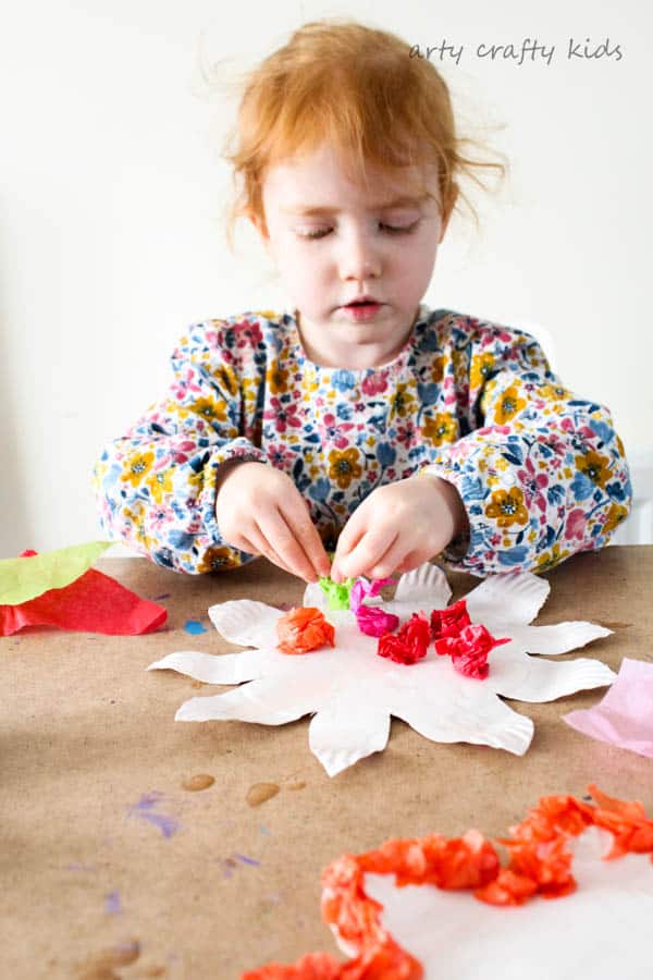 Arty Crafty Kids | Craft | Colourful Spring Paper Plate Flower Craft | A fun and simple Spring craft for kids. Toddlers and preschoolers will love the process of tearing, scrunching and sticking to make pretty paper plate flowers.