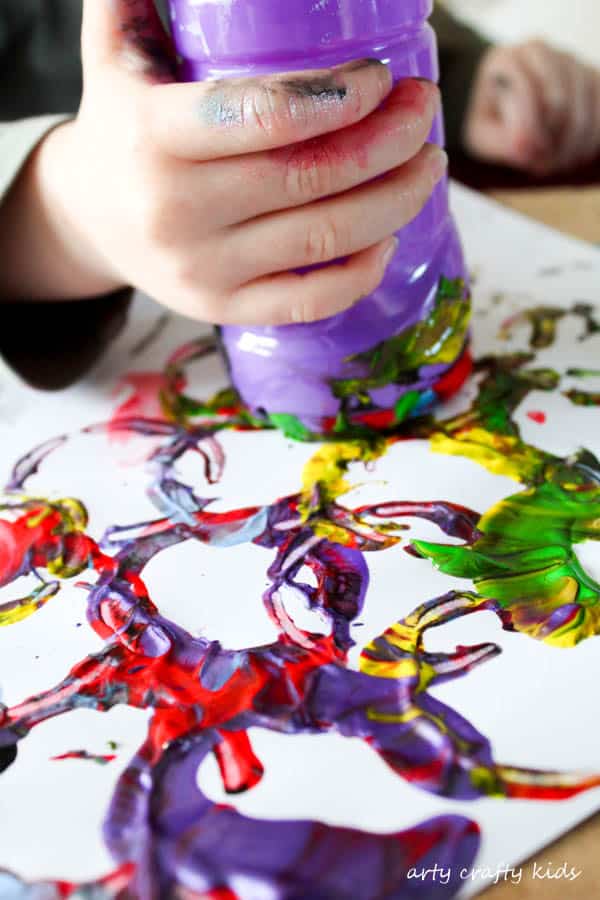 Arty Crafty Kids | Art | Kids Art Plastic Bottle Stamping | Simple art idea for kids using recycled plastic bottles, creating fun and unusual shapes and patterns.