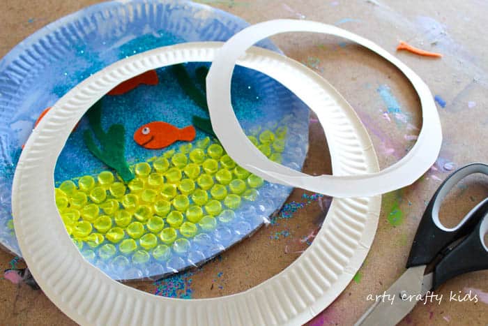 Arty Crafty Kids | Craft | Paper Plate Goldfish Bowl Craft | A fun and interactive goldfish bowl craft idea for kids.