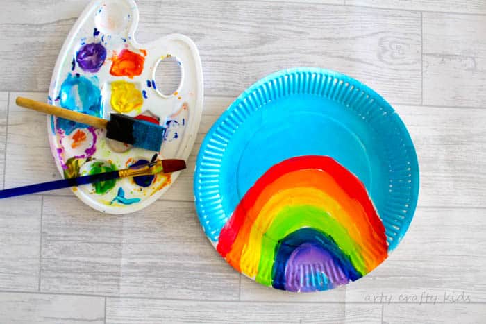 Arty Crafty Kid | Craft | Over the Rainbow Paper Plate Unicorn Puppets | Using the free Unicorn download, cut and colour to create playful puppets, who love to jump, slide and dance over the cute paper plate rainbow! A fun interactive craft and play craft idea for kids!