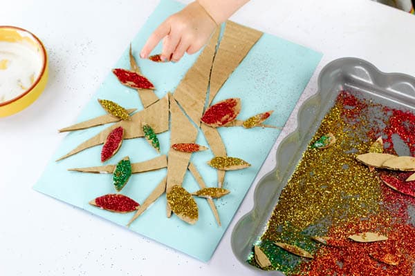 Arty Crafty Kids | Craft | Cardboard Autumn Glitter Tree | A colourful Autumn tree craft using cut up recycled cardboard to assemble a tree. Great fine motor activity for young children!