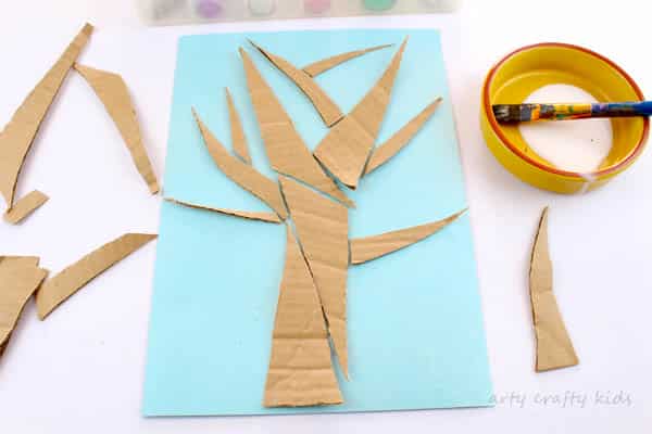 Arty Crafty Kids | Craft | Cardboard Autumn Glitter Tree | A colourful Autumn tree craft using cut up recycled cardboard to assemble a tree. Great fine motor activity for young children!