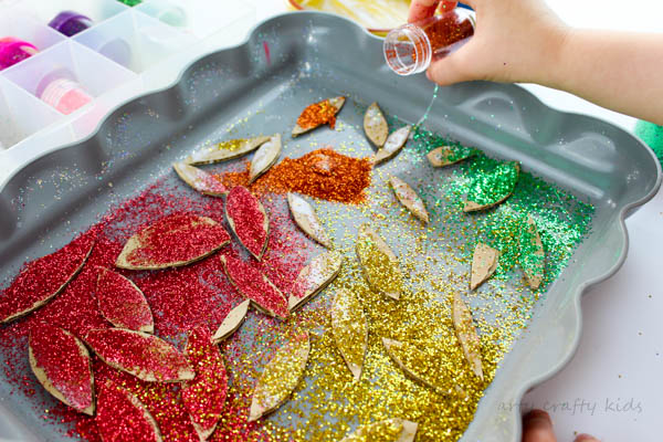 Arty Crafty Kids | Craft | Cardboard Autumn Glitter Tree | A colourful Autumn tree craft using cut up recycled cardboard to assemble a tree. Great fine motor activity for young children!