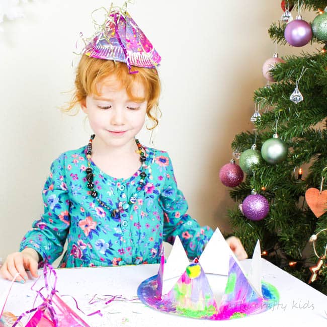 Arty Crafty Kids | Easy Paper Plate Party Hats | A fabulous Christmas or New Years Eve party Craft for kids using paper plates! Learn how to transform a paper plates into party hats using our two designs!