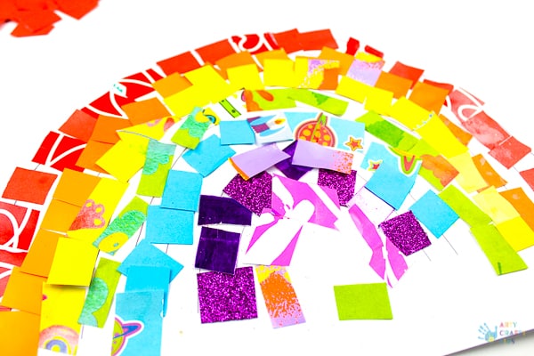 Arty Crafty Kids | Art Ideas for Kids | Rainbow Paper Collage | A fabulous rainbow paper collage activity that promotes cutting skills & colour play within a free rainbow template for kids to follow #rainbowart #preschoolart #craftsforpreschoolers #kidscrafts #scissorskills