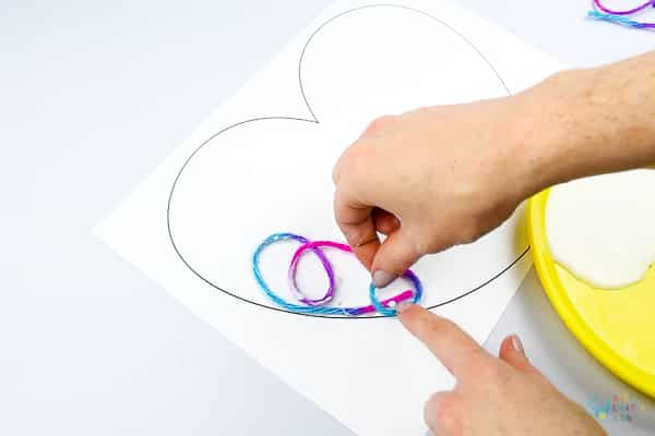 Arty Crafty Kids | Art Ideas for Kids | Yarn Squiggle Heart Art | A fun process art idea for kids, using yarn and watercolour paints to create a cute heart. A simple and fun art project for Valentine's Day! #Valentinesday #artforkids #easyartforkids