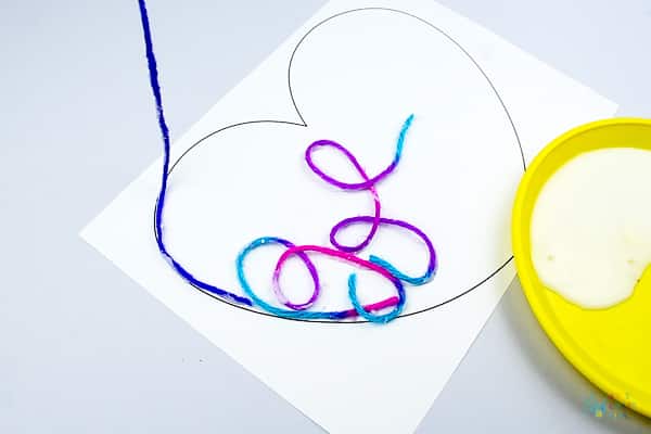 Arty Crafty Kids | Art Ideas for Kids | Yarn Squiggle Heart Art | A fun process art idea for kids, using yarn and watercolour paints to create a cute heart. A simple and fun art project for Valentine's Day! #Valentinesday #artforkids #easyartforkids