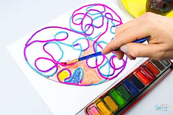 Arty Crafty Kids | Art Ideas for Kids | Yarn Squiggle Heart Art | A fun process art idea for kids, using yarn and watercolour paints to create a cute heart. A simple and fun art project for Valentine's Day! #Valentinesday #artforkids #easyartforkids