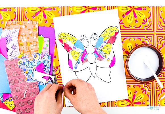 Arty Crafty Kids | Art | Butterly Paper Collage - A simple activity using torn scrap paper to create a colourful, textured butterfly. A wonderful craft for kids! #artycraftykids #recycledcraft #easykidscraft #craftsforkids #kidsart #artideasforkids #easykidsactivities