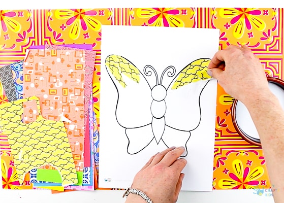 Arty Crafty Kids | Art | Butterly Paper Collage - A simple activity using torn scrap paper to create a colourful, textured butterfly. A wonderful craft for kids! #artycraftykids #recycledcraft #easykidscraft #craftsforkids #kidsart #artideasforkids #easykidsactivities