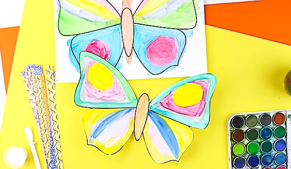 Arty Crafty Kids | Craft | Woven Paper Butterfly Craft - A sweet and simple Spring & Summer craft for kids, that's great for kids working on their fine motor skills. It's also very pretty too! #butterflycraft #kidscrafts #craftsforkids #easykidscrafts #craftideasforkids #summercrafts #springcrafts #minibeasts