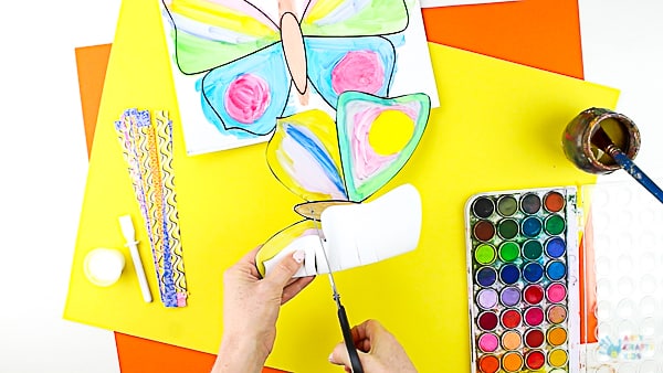 Arty Crafty Kids | Craft | Woven Paper Butterfly Craft - A sweet and simple Spring & Summer craft for kids, that's great for kids working on their fine motor skills. It's also very pretty too! #butterflycraft #kidscrafts #craftsforkids #easykidscrafts #craftideasforkids #summercrafts #springcrafts #minibeasts