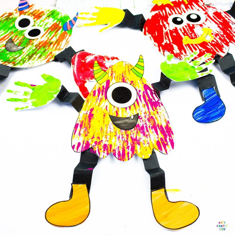 Arty Crafty Kids | Big Hand Paper Monster Craft - Add your Arty Crafty Kids handprint to create a moving grooving Big Hand Monster! A fun and playful monster craft for Halloween, with a choice of 4 monster templates.