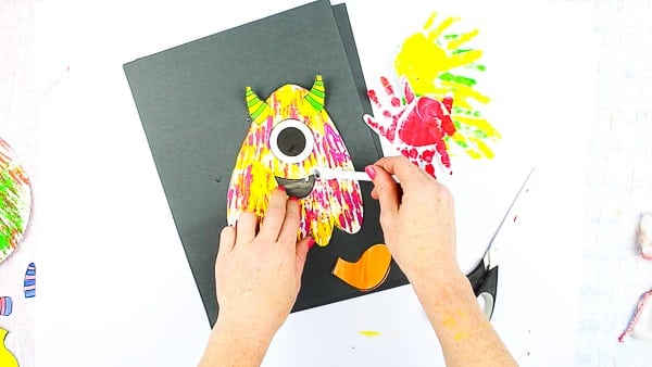 Arty Crafty Kids | Big Hand Paper Monster Craft - Add your Arty Crafty Kids handprint to create a moving grooving Big Hand Monster! A fun and playful monster craft for Halloween, with a choice of 4 monster templates.