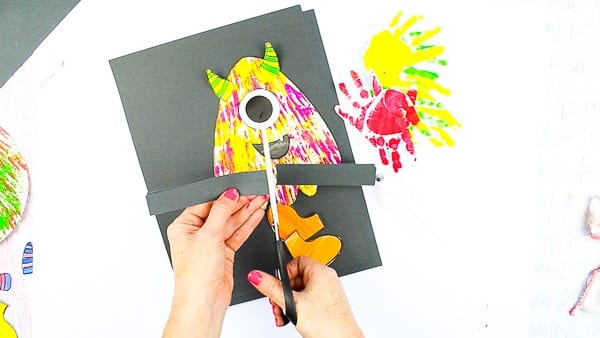 Arty Crafty Kids | Big Hand Paper Monster Craft - Add your Arty Crafty Kids handprint to create a moving grooving Big Hand Monster! A fun and playful monster craft for Halloween, with a choice of 4 monster templates.