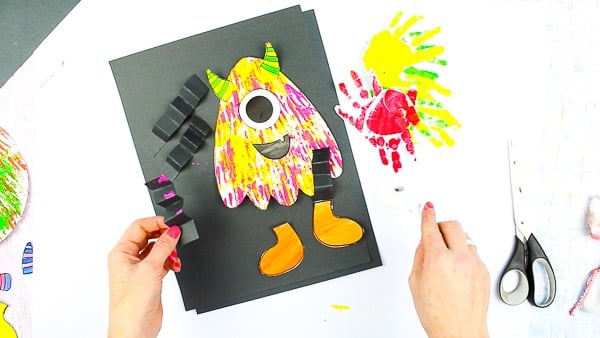 Arty Crafty Kids | Big Hand Paper Monster Craft - Add your Arty Crafty Kids handprint to create a moving grooving Big Hand Monster! A fun and playful monster craft for Halloween, with a choice of 4 monster templates.