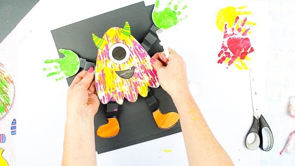 Arty Crafty Kids | Big Hand Paper Monster Craft - Add your Arty Crafty Kids handprint to create a moving grooving Big Hand Monster! A fun and playful monster craft for Halloween, with a choice of 4 monster templates.