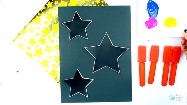 Arty Crafty Kids - Christmas Ornament Art for Kids. A fun and easy Christmas activity for kids, that plays with negative space to create gorgeous Christmas Ornament Silhouettes. #christmas #christmascrafts #kidscrafts