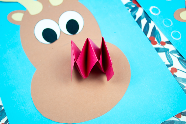 Arty Crafty Kids | Jingle Bells Rudolph Reindeer Craft - Explore and play with round shapes to create a Rudolph the Red Nosed Reindeer #kidscrafts #rudolph #christmascrafts #christmas