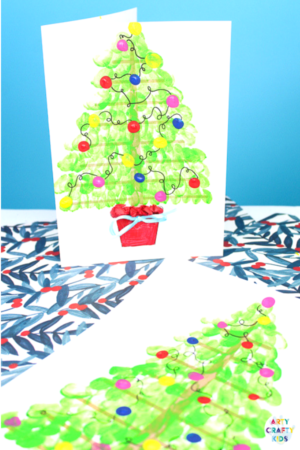 Arty Crafty Kids | Fingerprint Christmas Tree Card - Using the template as a card, kids can add a personal touch to their Christmas Cards by adding their fingerprints to form a Christmas Tree. A simple, beautiful Christmas card idea that kids will love creating #christmascrafts #christmas #papercrafts #kidscrafts #template #printables
