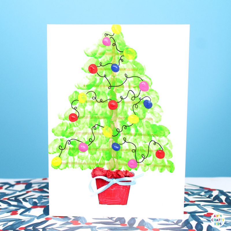 Arty Crafty Kids | Fingerprint Christmas Tree Card - Using the template as a card, kids can add a personal touch to their Christmas Cards by adding their fingerprints to form a Christmas Tree. A simple, beautiful Christmas card idea that kids will love creating #christmascrafts #christmas #papercrafts #kidscrafts #template #printables