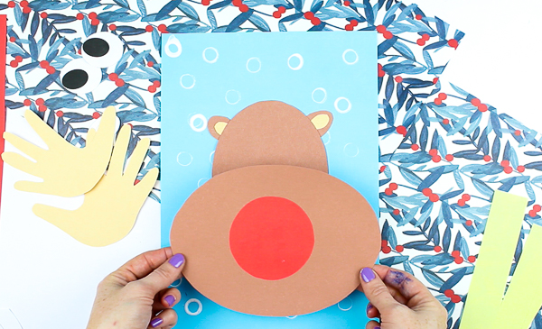 Arty Crafty Kids | 3D Printable Rudolph Craft for Kids. Play with shapes and dimension to create a cool 3D Reindeer with bouncy handprint antler! A fun and engaging Christmas craft for kids #christmas #printable #papercraft #christmascrafts #kids #kidscrafts