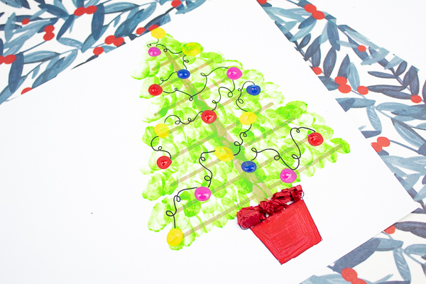 Arty Crafty Kids | Fingerprint Christmas Tree Card - Using the template as a card, kids can add a personal touch to their Christmas Cards by adding their fingerprints to form a Christmas Tree. A simple, beautiful Christmas card idea that kids will love creating #christmascrafts #christmas #papercrafts #kidscrafts #template #printables