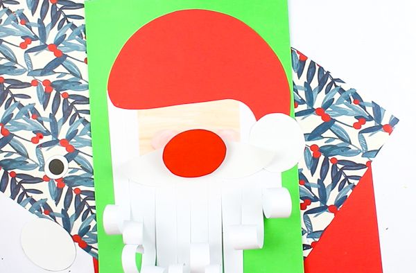 Arty Crafty Kids | Printable Paper Santa Craft - An engaging and fun Paper Santa Craft for kids. With his bouncy nose and curly beard, it's a Christmas craft that promotes scissor skills and fine motor development #christmas #christmascraft #printable #kidscraft #template