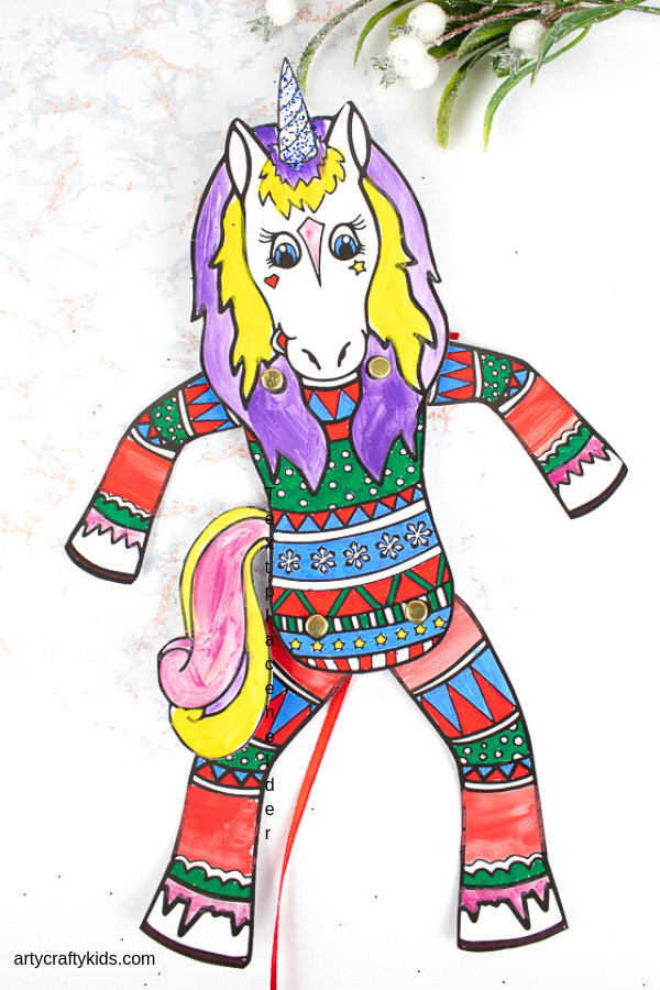 Arty Crafty Kids Printable Unicorn Puppets in Christmas Pyjamas - Have a crafty unicorn pyjama party with these cute printable unicorns! An engaging craft for kids with the option of a 'design your own' free template or three pre-made unicorn in pyjama templates! #unicorns #kidscrafts #craftsforkids #christmas #printable #christmascrafts