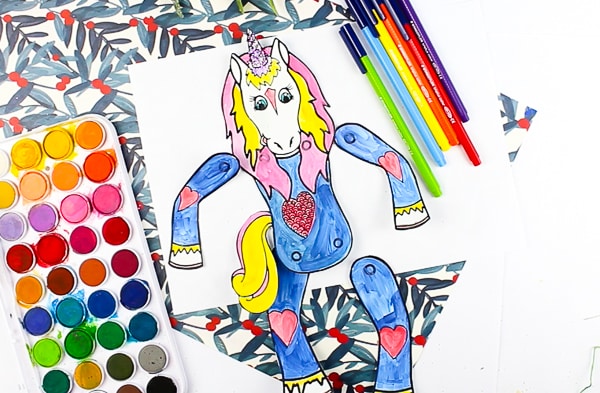 Arty Crafty Kids Printable Unicorn Puppets in Christmas Pyjamas - Have a crafty unicorn pyjama party with these cute printable unicorns! An engaging craft for kids with the option of a 'design your own' free template or three pre-made unicorn in pyjama templates! #unicorns #kidscrafts #craftsforkids #christmas #printable #christmascrafts