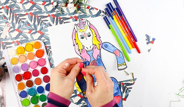 Arty Crafty Kids Printable Unicorn Puppets in Christmas Pyjamas - Have a crafty unicorn pyjama party with these cute printable unicorns! An engaging craft for kids with the option of a 'design your own' free template or three pre-made unicorn in pyjama templates! #unicorns #kidscrafts #craftsforkids #christmas #printable #christmascrafts