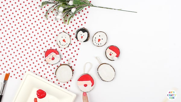Arty Crafty Kids | How to Make Wood Slice Christmas Ornaments - An easy Christmas Ornament for kids to make. Follow our tutorial to create a Santa Claus, Snowman and Penguin Ornaments #kidscrafts #christmascrafts #kids #christmas