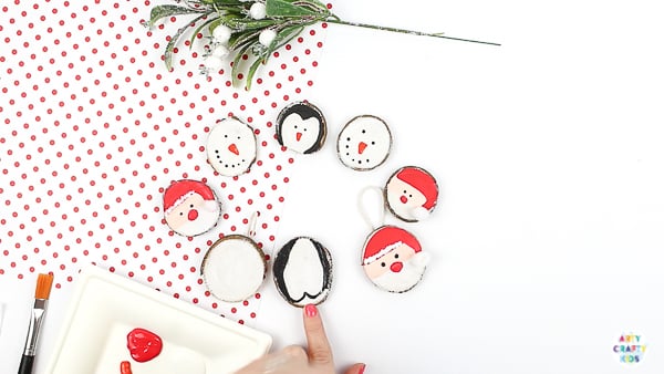 Arty Crafty Kids | How to Make Wood Slice Christmas Ornaments - An easy Christmas Ornament for kids to make. Follow our tutorial to create a Santa Claus, Snowman and Penguin Ornaments #kidscrafts #christmascrafts #kids #christmas