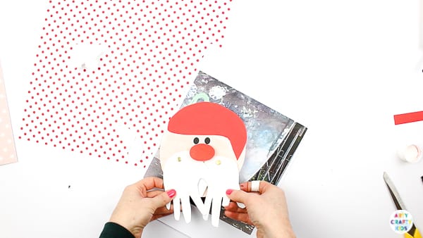 Arty Crafty Kids | Santa Handprint Craft - A printable Santa Christmas Card craft for kids! simply unfold the handprint beard to reveal your Arty Crafty Kid wishing loved ones a Merry Christmas #printable #christmascraft #kidscraft