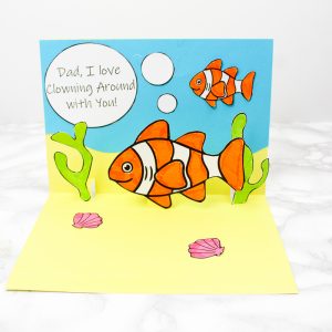 How to make a Clown Fish Father's Day Pop Up Card - An adorable father's day craft that kids will love making. Download the pop up card template to get started! #artycraftykids #fathersday #kidscrafts