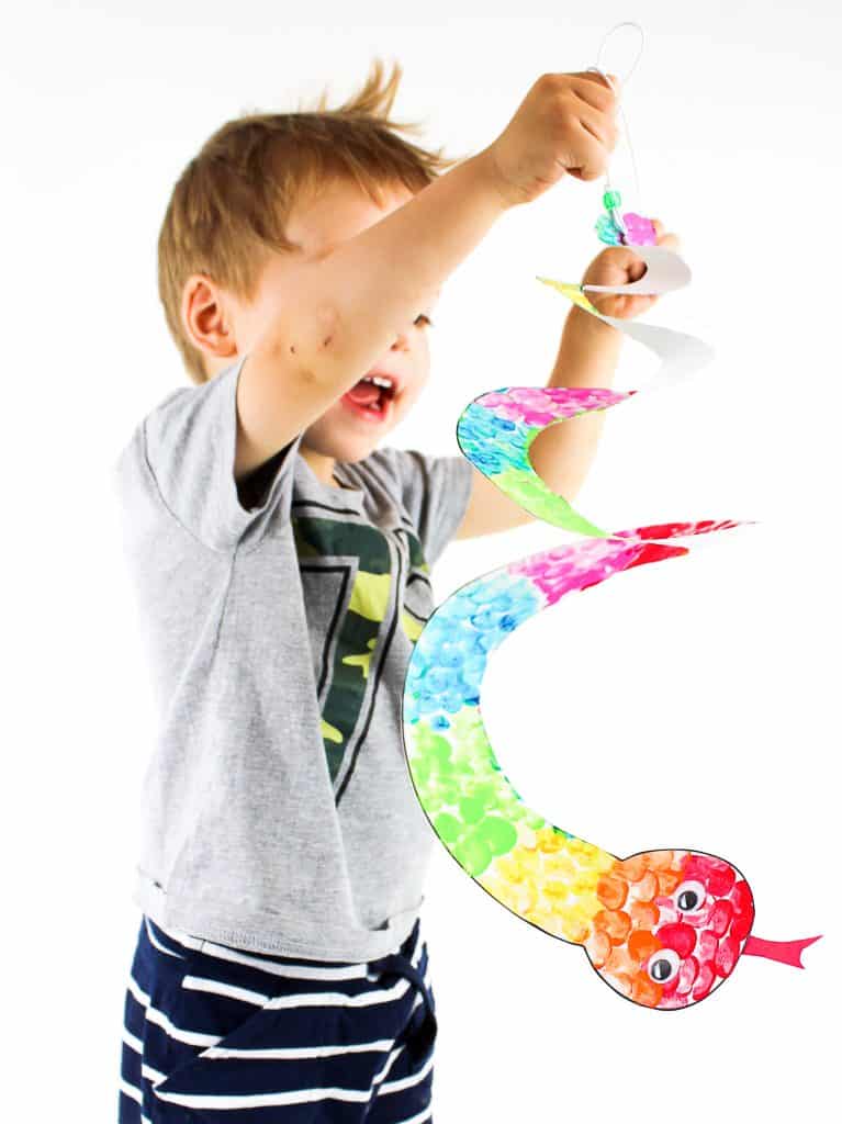 Arty Crafty Kids | Printable Spiral Snake Mobile Craft for Kids | This super cute snake craft is a fantastic scissors skills project for kids in preschool, kindergarten and primary school #artycraftykids