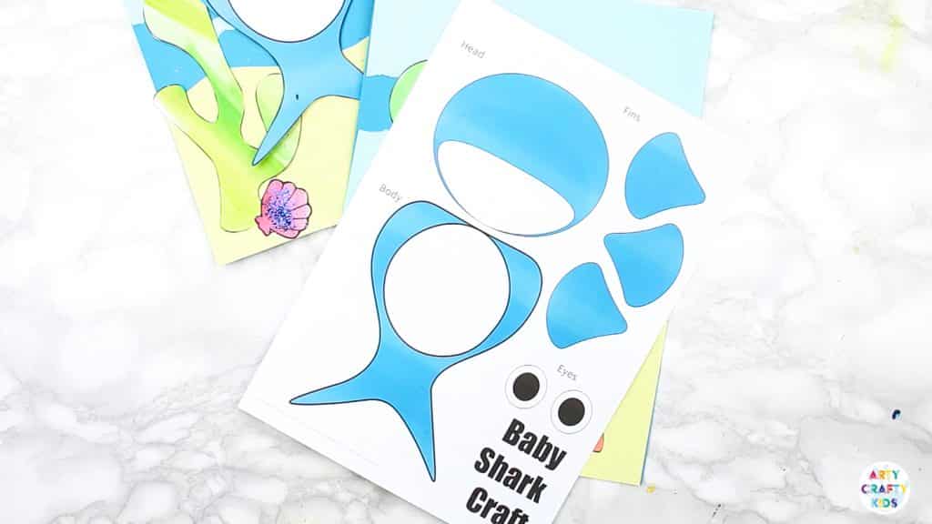 An easy Swimming Baby Shark Craft for kids to make. A great printable shark craft for  Summer and shark week. #artycraftykids #sharkweek #craftsforkids