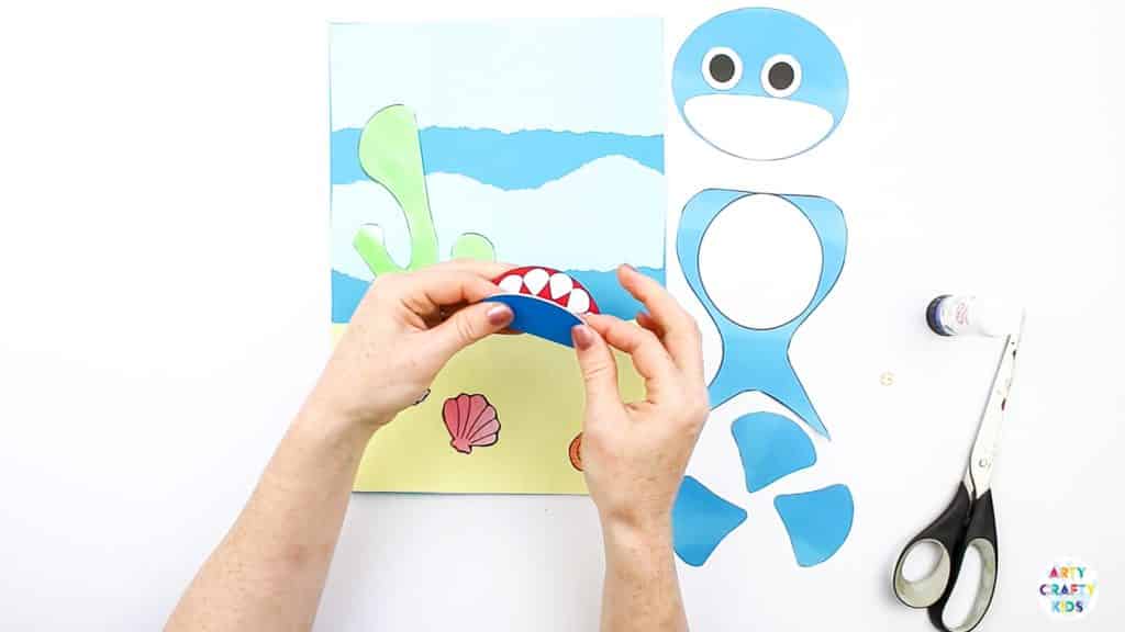 An easy Swimming Baby Shark Craft for kids to make. A great printable shark craft for  Summer and shark week. #artycraftykids #sharkweek #craftsforkids