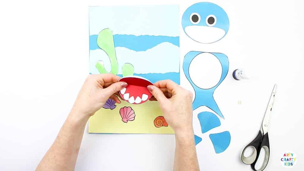 An easy Swimming Baby Shark Craft for kids to make. A great printable shark craft for  Summer and shark week. #artycraftykids #sharkweek #craftsforkids