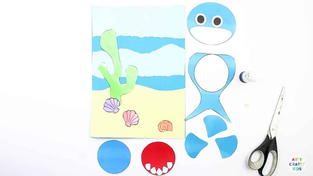 An easy Swimming Baby Shark Craft for kids to make. A great printable shark craft for  Summer and shark week. #artycraftykids #sharkweek #craftsforkids