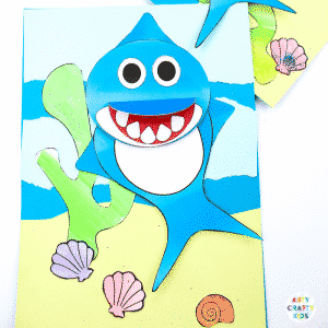 An easy Swimming Baby Shark Craft for kids to make. A great printable shark craft for Summer and shark week. #artycraftykids #sharkweek #craftsforkids