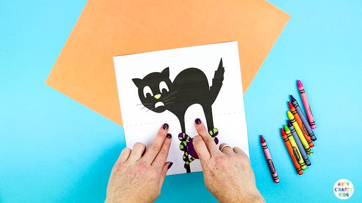 Arty Crafty Kids | Surprise Black Cat Printable Craft  - A fun Halloween craft for kids. Unfold the paper toy to reveal and an eight legged surprise!