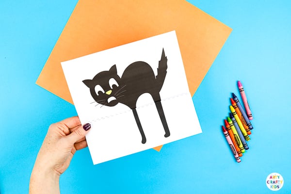 Arty Crafty Kids | Surprise Black Cat Printable Craft  - A fun Halloween craft for kids. Unfold the paper toy to reveal and an eight legged surprise!